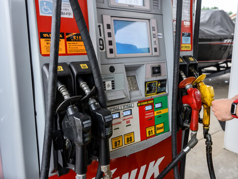 Duluth, MN, USA - Jul 25, 2026: Close-up of a modern fuel pump at a Kwik Trip station, showing multiple nozzles, octane selection buttons.