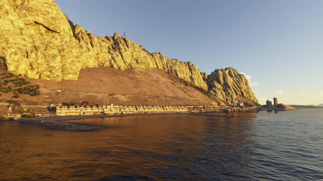 Circular aerial drone view at sunset of Sir Herbert Miles and Sandy Bay in Gibraltar. United Kingdom