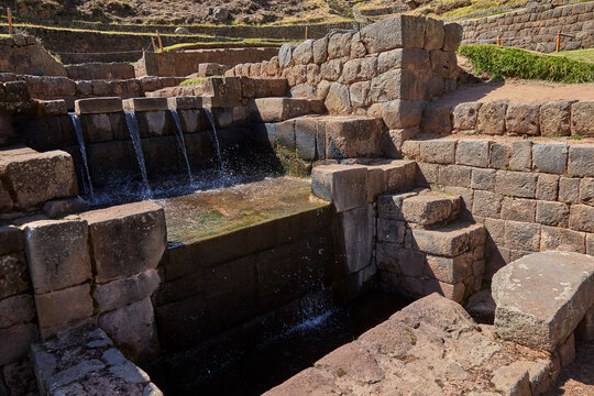 Four parallel jets of crystal clear water cascade over precisely cut Inca stonework at Tipon, one of the most extraordinary examples of hydraulic engineering left by the ancient Andean world. 
