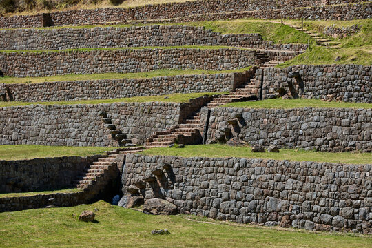 Massive stone terraces sweep across the hillside at Tipon, stepping down the mountainside in a display of Inca agricultural and hydraulic engineering rarely matched anywhere in the Andes. 