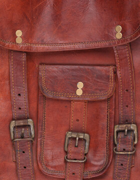 old leather pocket with leather straps