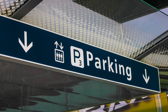 Parking level sign with arrows in airport