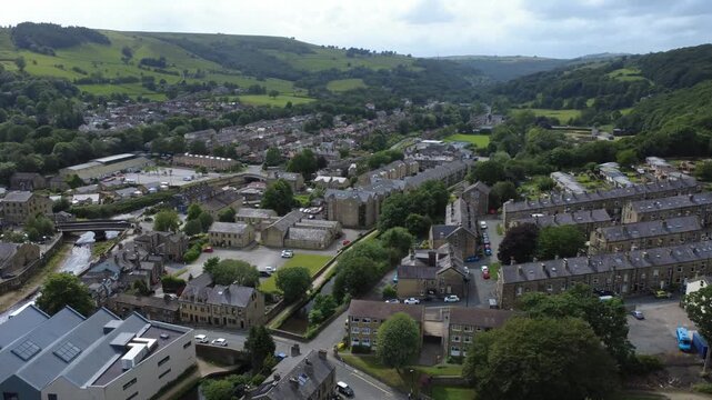 Aerial view of the village of Mytholmroyd in West Yorkshire showing the streets and houses surrounding the river and Rochdale canal
