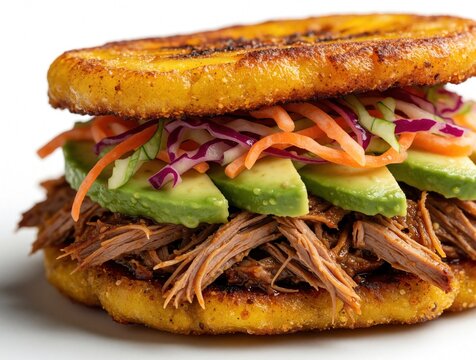 Crispy fried plantain sandwich filled with shredded beef avocado, vegetable slaw. Tasty Latin American patacon food served as delicious street food snack on white background. Savory tropical meal for