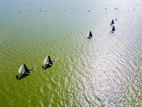 STAVOREN, THE NETHERLANDS AUGUST 12, 2023: Traditional Skutsjes Compete During the Annual SKS Skutsjesilen Sailing Championship on the IJsselmeer