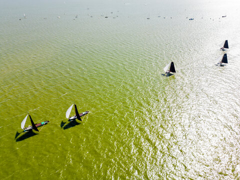 STAVOREN, THE NETHERLANDS AUGUST 12, 2023: Traditional Skutsjes Compete During the Annual SKS Skutsjesilen Sailing Championship on the IJsselmeer