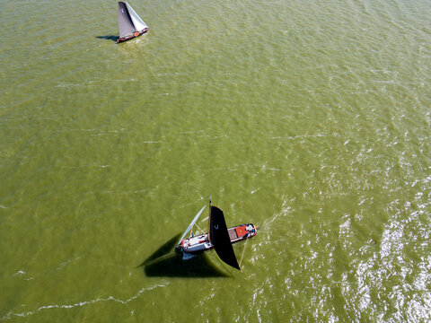 STAVOREN, THE NETHERLANDS AUGUST 12, 2023: Traditional Skutsjes Compete During the Annual SKS Skutsjesilen Sailing Championship on the IJsselmeer