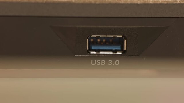 Close up slow motion studio shot of USB 3 3.0 female port and insert entry point for computer and technology cables for accessories to enter modern device as rectangular universal serial bus devices