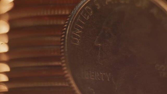 Close-up detailed macro view of George Washington on United States of America 25 cents coin worth one quarter of a dollar and quoting liberty and In God We Trust on money surface and U.S. currency 4k