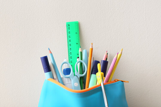 Colorful school supplies in a blue pencil case, back to school and education concept, stationery for students