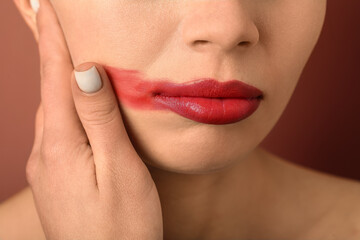 Naklejka premium Woman with red lips on color background, closeup