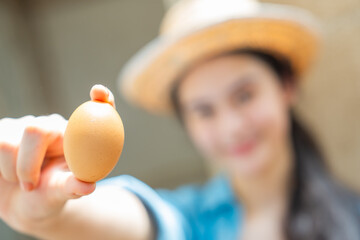 ํYoung woman collecting fresh eggs in chicken coop. Teenager girl with organic farming and free range poultry, sustainable agriculture, rural farm lifestyle and healthy food production. © CandyRetriever 
