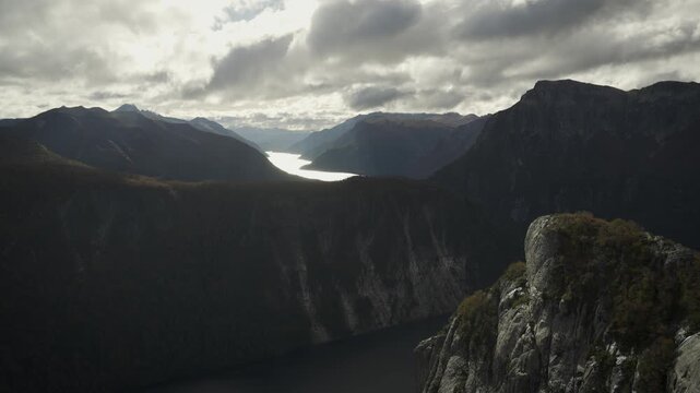 Panoramic landscape view from La Mirada del Doctor viewpoint, showcasing dramatic mountain ranges and a reflecting lake in Nahuel Huapi National Park, Patagonia, Argentina.