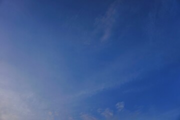 Fototapeta premium Vibrant Blue Sky with Wispy Clouds on a Clear Day.