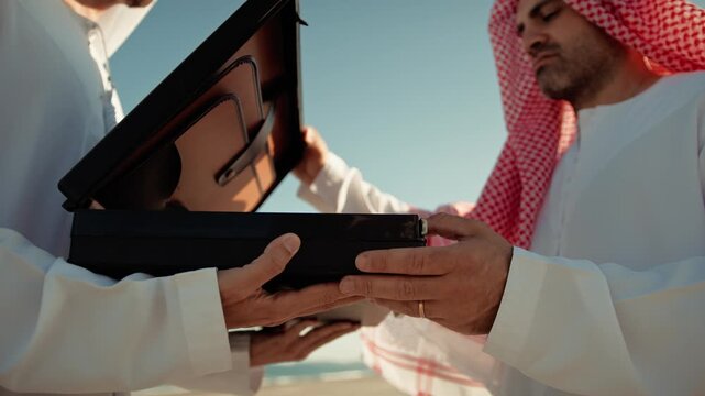 Sheiks Opening The Mysterious Black Briefcase 