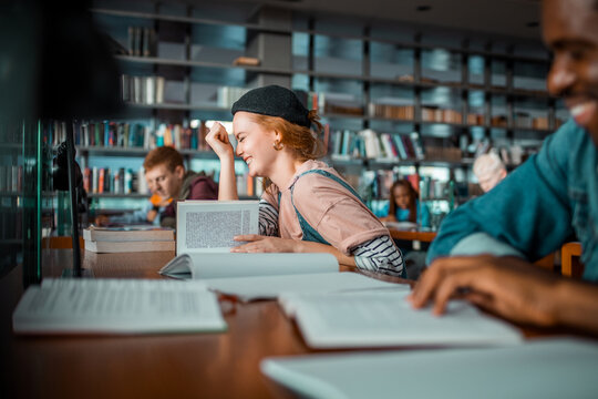 University students reading books in library