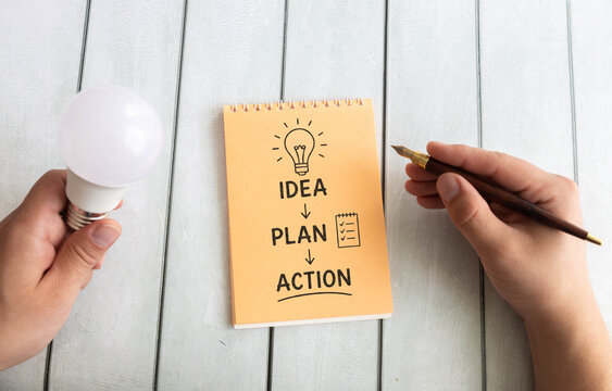 Idea to Action Workflow on Notepad with Light Bulb and Fountain Pen, Creative Planning and Productivity Concept.