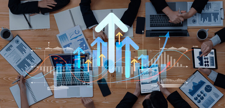 A collaborative business meeting showcasing financial growth with team members analyzing data on digital devices. Visual symbols of progress and strategy enhance the dynamic atmosphere. Cyphers