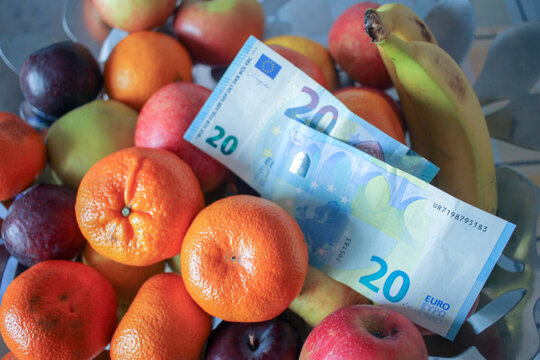 Euro Cash Banknotes Placed Over Fresh Fruits Symbolizing Inflation Rate