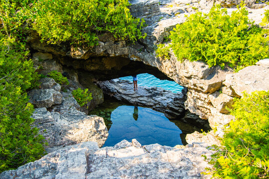 Bruce Penisula National Park, Canada - May 8 2026: Rugged limestone cliffs and crystal-clear turquoise waters frame the scenic Georgian Bay shoreline near the famous Grotto in Bruce Peninsula National