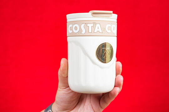 ZHONGSHAN China-June 21 2026: Costa Coffee insulated portable coffee tumbler held in human hand.