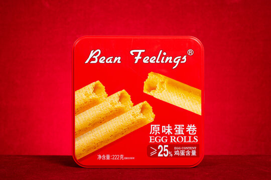 ZHONGSHAN China-February 12 2026: Bean Feelings original crispy egg rolls snack in red metal tin.
