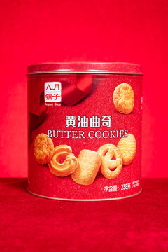 ZHONGSHAN China-February 12 2026: August Shop butter cookies stored inside round red metal tin.