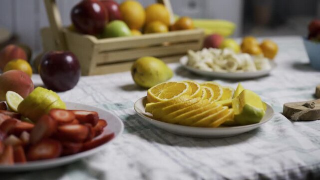 Many fruits displayed on kitchen counter - medium tracking shot