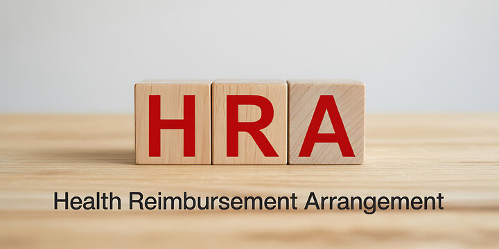 Wooden blocks spelling HRA with red letters and text Health Reimbursement Arrangement below