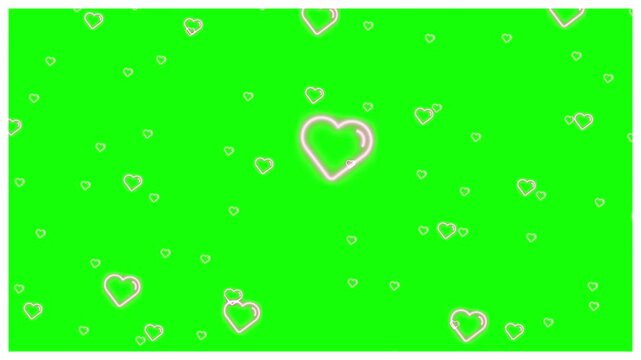 Hearts floating in a gentle animation against a vibrant chroma key green background display a romantic theme.