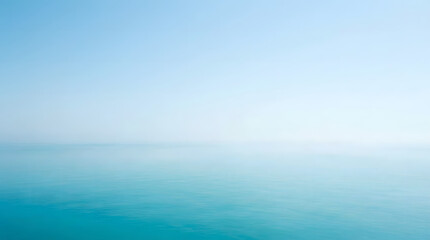Fototapeta premium Ocean horizon meets a clear blue sky in a serene and expansive view of calm water during the day.