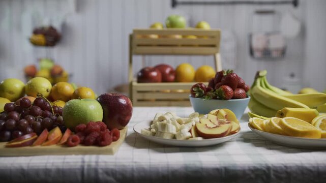 Tons of gorgeous, beautiful fruit on kitchen table, tracking shot