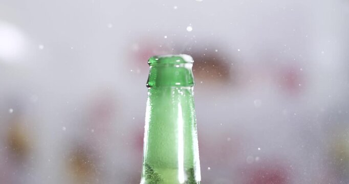 Slow motion beer splash from a freshly opened bottle