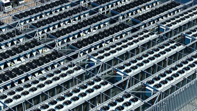 Cinematic drone view of cooling systems powering AI, cloud and digital services