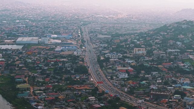 Aerial of Accra Ghana Urban landscape with highway, buildings and dense population settlement