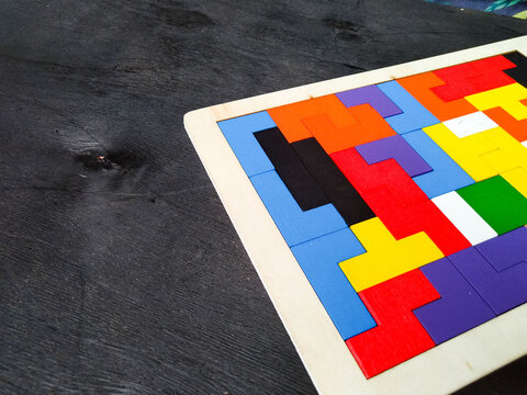 Puzzle with brain sharpening concept on black background