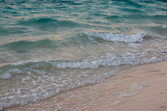Gentle Waves on Sandy Beach