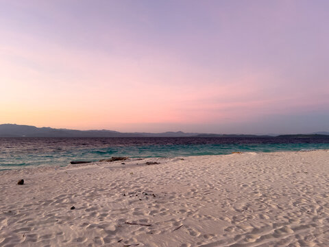 Peaceful Beach at Sunset with Pastel Sky