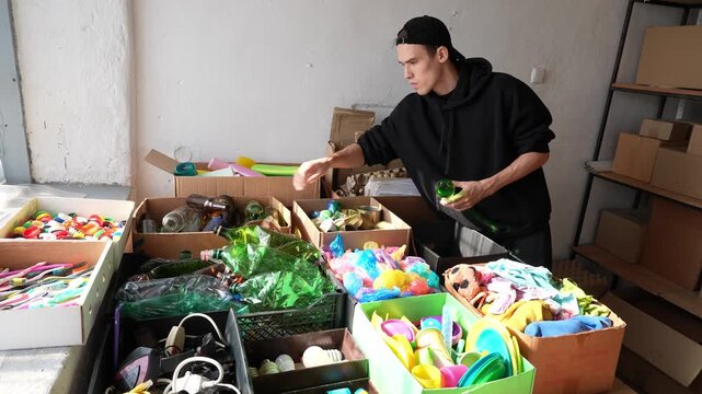 Volunteer at the waste collection point. Master classes on separate waste collection