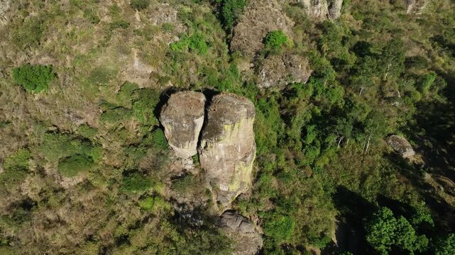 Top down aerial orbit of Piedrotas Los Compadres rock formations at El Nido del Zopilote in Las Pe&ntilde;as Ecological Park, Ciudad Guzm&aacute;n, Zapotl&aacute;n el Grande, Jalisco, Mexico