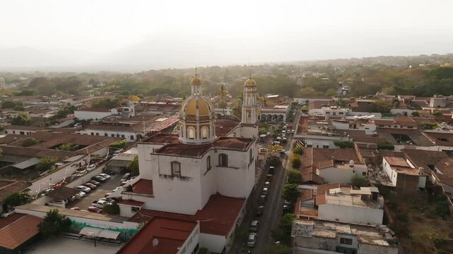 Panoramic aerial surrounding San Miguel Arc&aacute;ngel Church and downtown Comala, Colima, Mexico