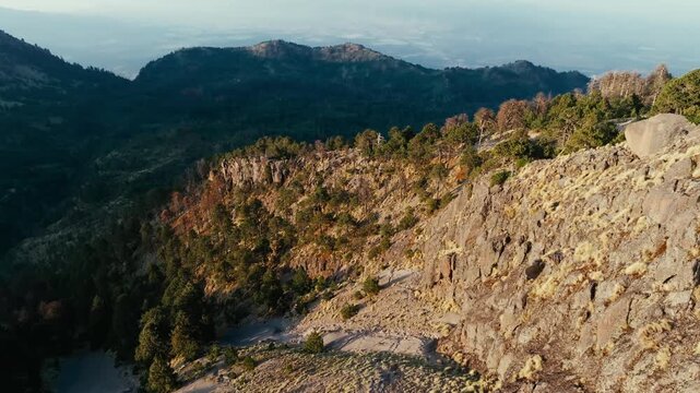 Magnificent view from Nevado de Colima showing a deep ravine and a rocky mountain slope