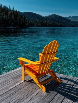 Bright Chair by a Lake on Wooden Deck in Nature