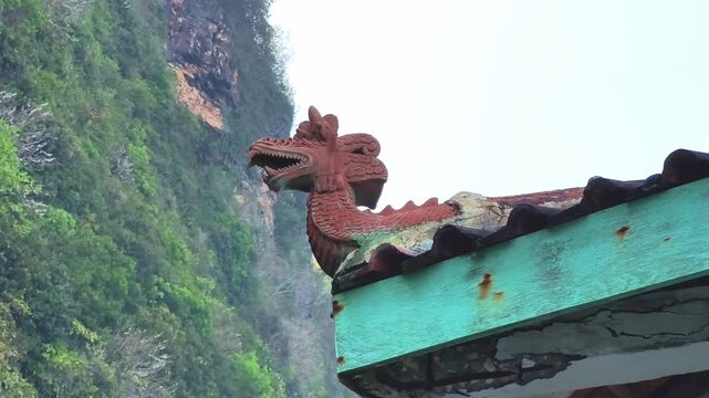 Traditional Cliffside Statue Overlooking the Turquoise Sea in HD