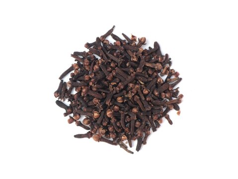 Top view of pile of whole dried cloves spice placed on a clean white background. Perfect visual representation for cooking ingredients, herbal medicine, aromatic spices, and culinary concepts