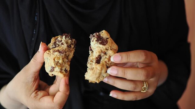 Sharing a chocolate chip cookie in a close setting