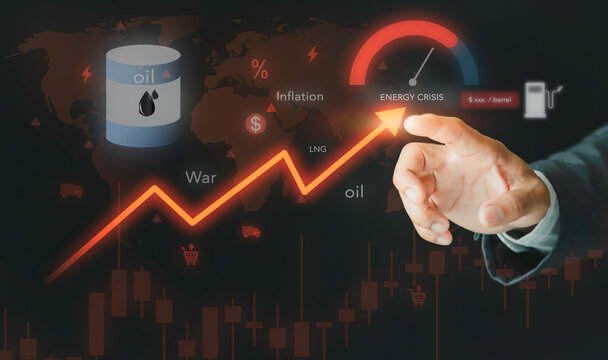 Businessman pointing at global energy crisis meter with oil barrel and rising inflation graph. Concept of geopolitical war impact, fuel price shock, supply chain disruption, and economy.