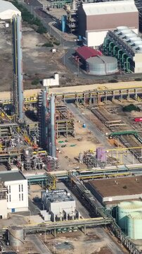 Footage shows an oil refinery complex and associated infrastructure. Industrial facilities are visible with active operations taking place at the site. The video captures various processing units.