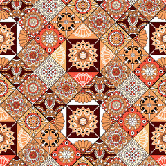 Seamless patchwork textile pattern featuring elegant floral mandalas, geometric tiles, ornamental motifs, and decorative folk-inspired elements in warm terracotta, coral, beige, cream, and brown tones © Juju