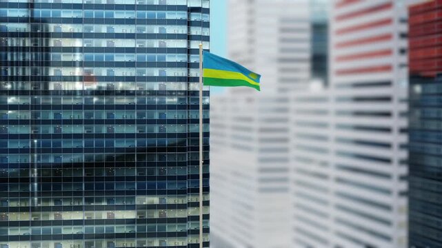 Rwanda Flag 3D Render Animation on Pole with Modern City Buildings - Shallow Depth of Field, Daytime View